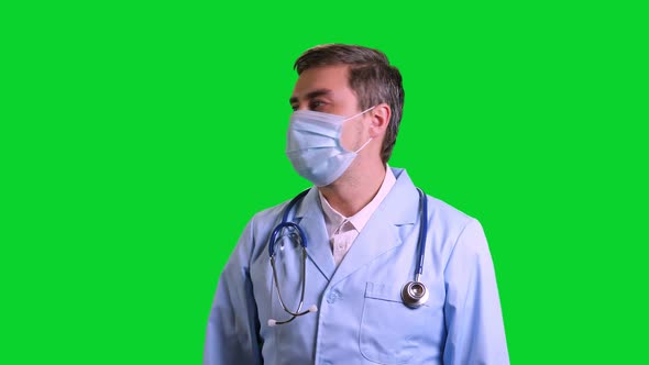 Young Doctor Stand and Looking Aside on Green Chroma Key Background