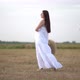 Beautiful Pregnant Woman in Wheat Field with Haystacks at Summer Day - VideoHive Item for Sale