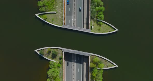 Highway traffic under Aquaduct Veluwemeer water bridge, Aerial view.