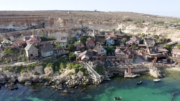 Picturesque Popeye Village theme park on a rocky shore of Malta,aerial.