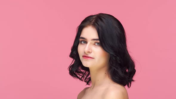 Studio portrait of young and beautiful brunette woman.