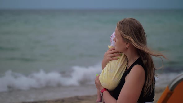 Mum with Baby Looking the Sea