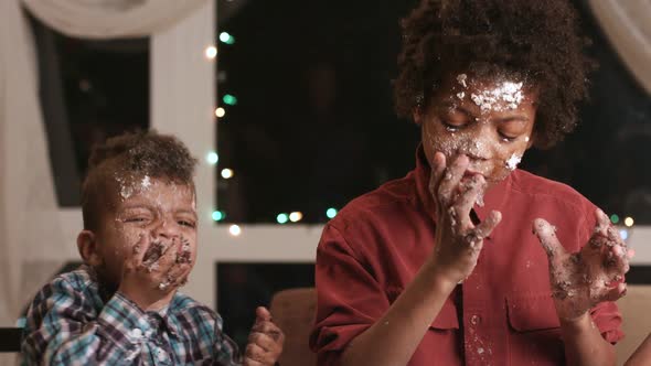 Two Black Boys Destroying Cake.
