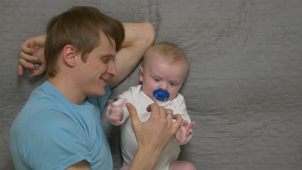 Father Playing With Baby