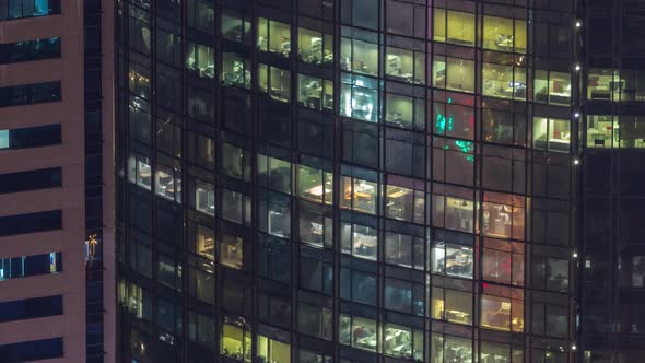 Windows in Highrise Building Exterior in the Late Evening with Interior Lights on Timelapse