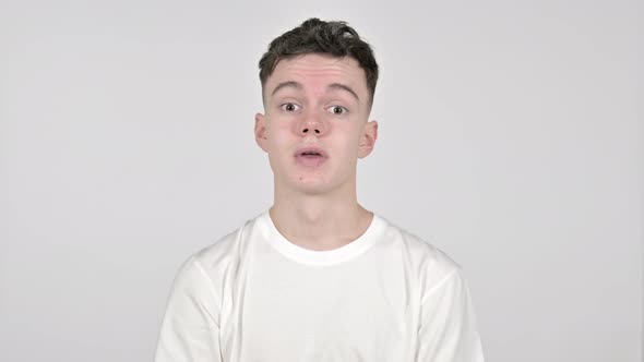 Yes, Young Man Shaking Head To Accept on White Background