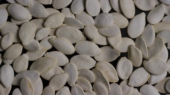 Cinematic, rotating shot of pumpking seeds - PUMPKIN SEEDS 004