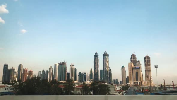 Drinving inside a car while seeing downtown Dubai through the side window of a vechile. Spectacular