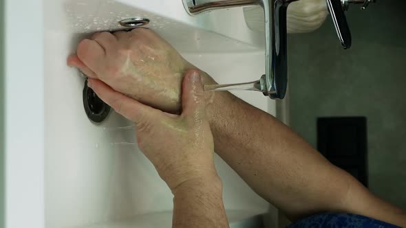 Vertical Video Washing Hands. Prevention Of The Coronavirus Pandemic Wash Your Hands With Warm Water