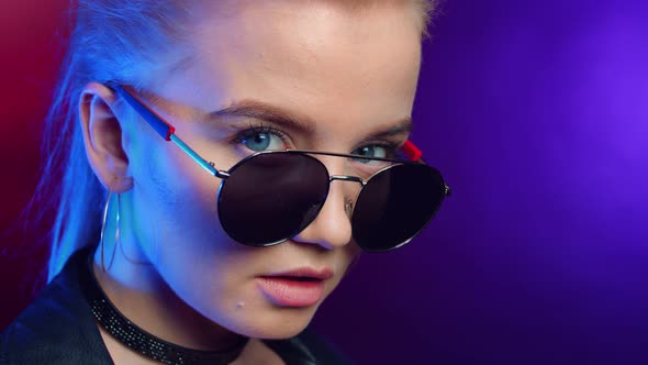 Extreme Close Up Portrait of Trendy Clubber Female in Black Sunglasses