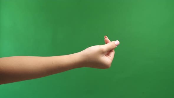 Hand Signs Gesture To Be Little Heart From Tip Of Thumb And Index Finger On Green Screen Background