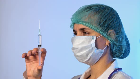 Female Doctor Holding Medical Injection Syringe