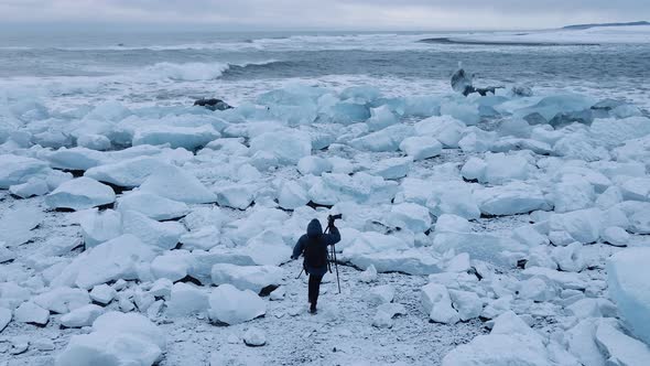 Drone Over Photographer on Diamond Beach Near Glacier Lagoon of Iceland