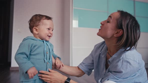 Mother and Her Baby Son Having Fun and Playing at Home