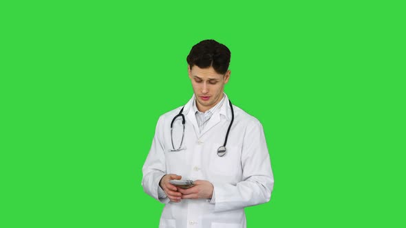 Doctor Counting Euro and Dancing on a Green Screen, Chroma Key