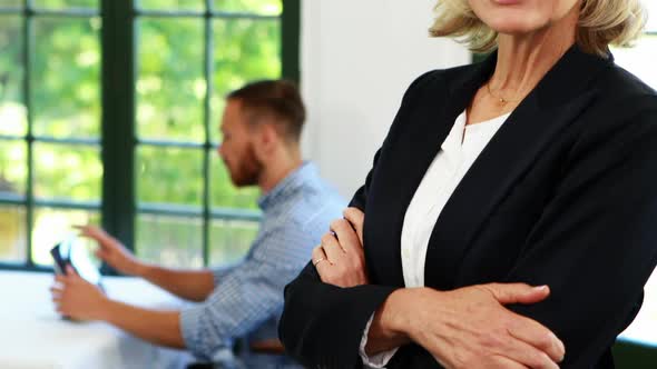 Businesswoman standing with arms crossed 4k