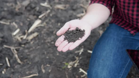 Farmer Hand with Fertile Soil