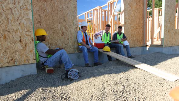 Group of construction workers taking a break