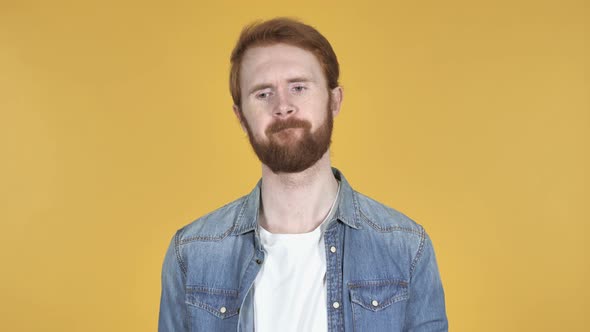 Sad Upset Redhead Man, Yellow Background