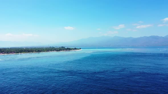 Aerial drone view scenery of beautiful seashore beach adventure by blue sea with bright sand backgro