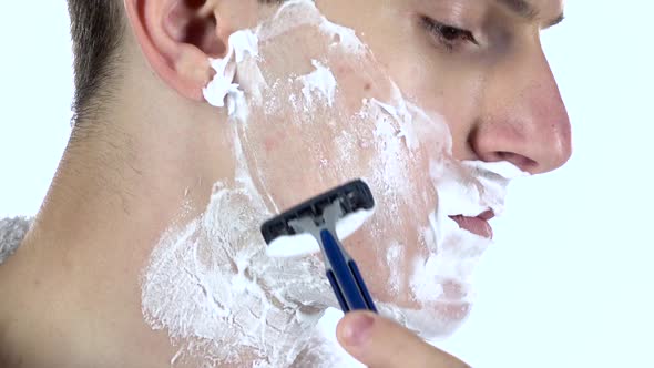 Guy Shaving, Part of Morning Routine. White Background. Slow Motion