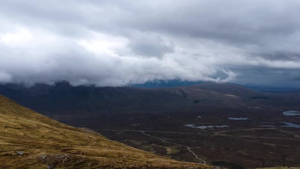 Cinematic drone shot of scottish misty mountains