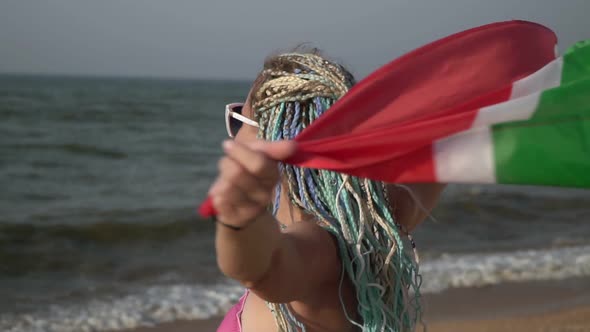 Beautiful Woman with South African Flag on the Sea Beach Slow Motion