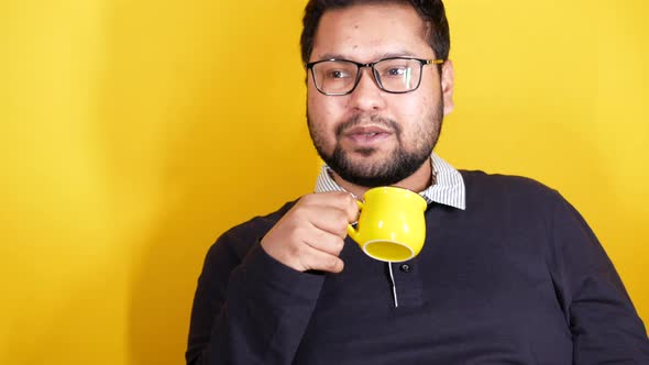 Close Up of Man Hand Holding Yellow Color Mug
