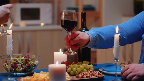 Close Up of Toasting with Wine