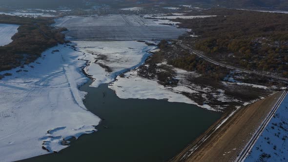 Flight Over A Dam On A Snowy Winter Day 