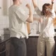 Happy Young Caucasian Married Couple Enjoy Dancing at Home in Kitchen - VideoHive Item for Sale