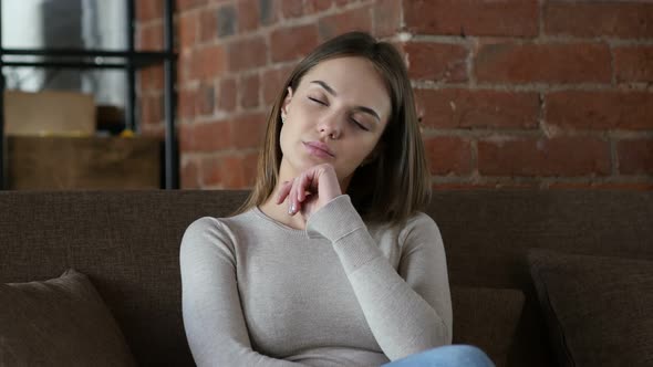 Tired Female Designer Sleeping in Office