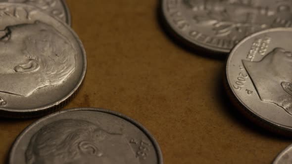 Rotating stock footage shot of American dimes (coin - $0.10) 