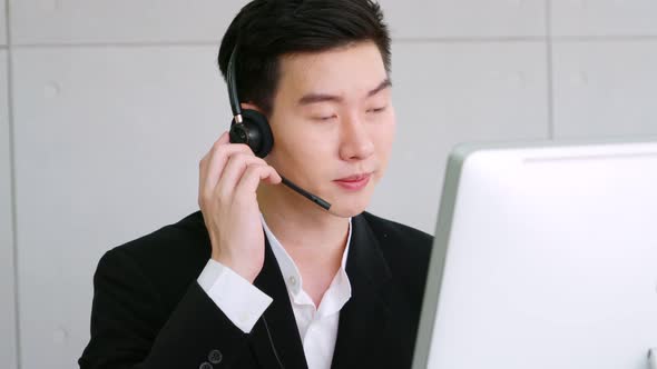 Business People Wearing Headset Working in Office