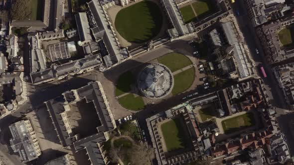 Top down circling drone shot of Bodleian library Radcliffe Camera building Oxford