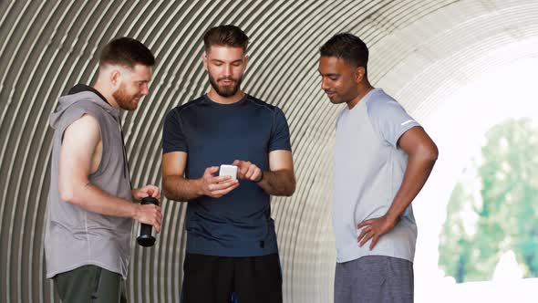 Sporty Men or Friends with Smartphone Outdoors