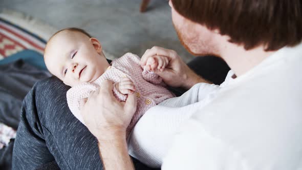 Dad Playing with Positive Baby Daughter