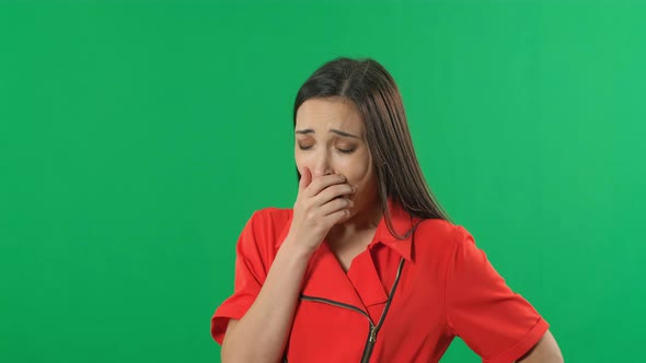 Yawning Girl in Green Screen Background. Sleepy Young Business Woman. Chroma Key Footage