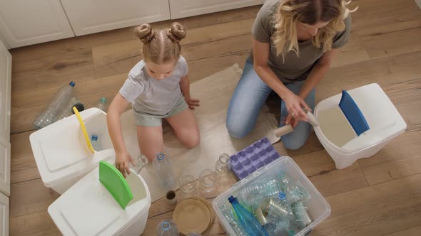 Video of family separating recycling material at home. Shot with RED helium camera in 8K