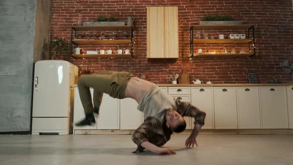 Happy Young Man Dances In The Kitchen.