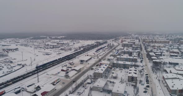 Sovetskiy city. Railway station and the trains.  Aerial. Winter, snow 06