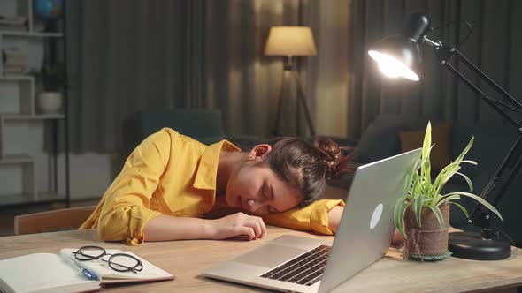 Asia Girl Sleeping While Working From Home At Living Room At Night