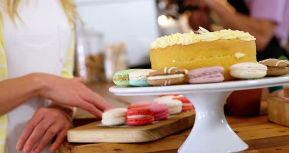 Smiling woman looking at desserts