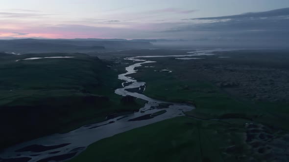 River Winding in Nordic Countryside at Dusk