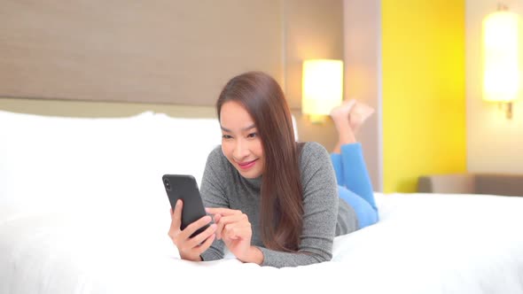 Young asian woman use smart phone