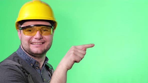 Construction Worker Wearing a Yellow Helmet He Poses on a Background of Chromakey