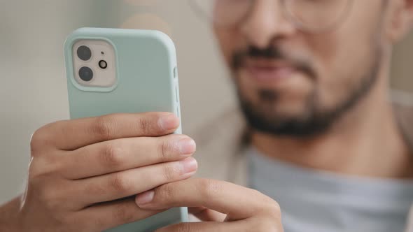 Closeup of Male Hands with Smartphone Indoors