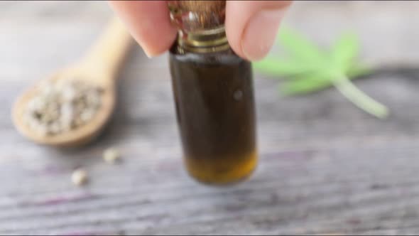 Placing Bottle of CBD Oil