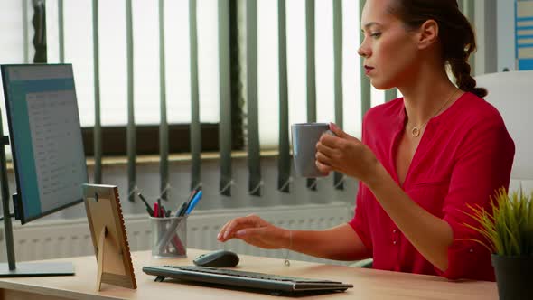 Freelancer Drinking Coffee at the Office