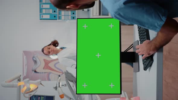 Vertical Video Man Nurse Working with Keyboard and Monitor